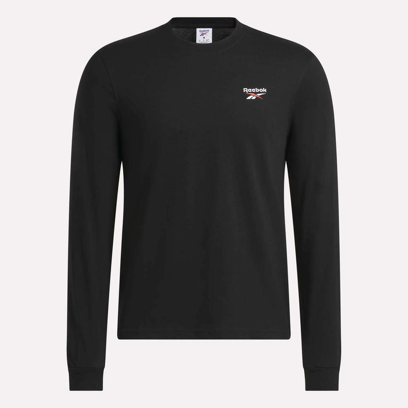 The Reebok Men's Long Sleeve T-Shirt is shown against a plain light background, featuring a classic crew neck design in black, soft cotton fabric, and a small white Reebok logo on the left chest.