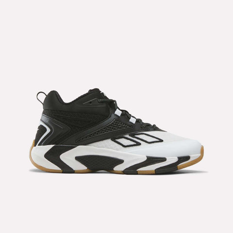 The Reebok Zone Breaker Shoes - Big Kids, shown in white, black, and gum with geometric designs and a gum-colored sole, are pictured from a side view against a plain white background; these boys’ basketball sneakers offer excellent ankle support for active play.