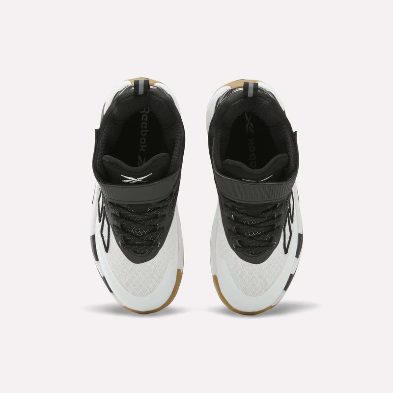 Top view of a pair of Reebok Zone Breaker Shoes for little kids, featuring black, white, and brown detailing with black laces and the Reebok logo visible on the black insoles. These basketball shoes have a mid-cut design and are positioned side by side on a white background.