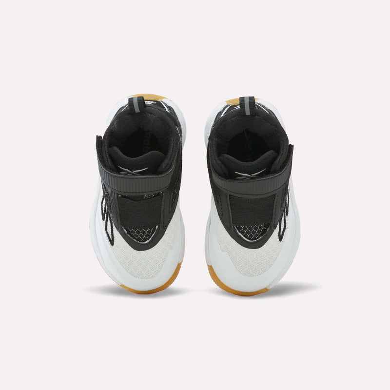 A pair of Reebok Zone Breaker Shoes - Toddler in black, white, and brown are displayed side by side on a light background, viewed from above to highlight the tops, laces, and straps. These basketball shoes offer a supportive ankle design that delivers comfort and style for active little boys.