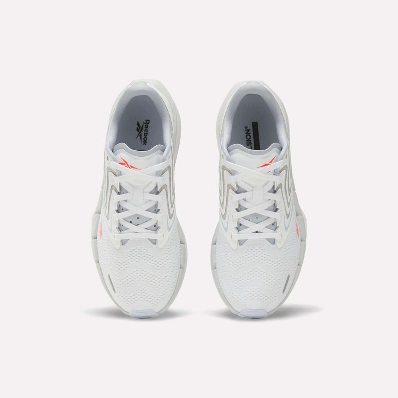 A pair of Women's FloatZig Tread Running Shoes by Reebok, viewed from above, with a breathable mesh upper, grey accents, and small orange Reebok logos on each tongue—perfect for treadmill workouts.