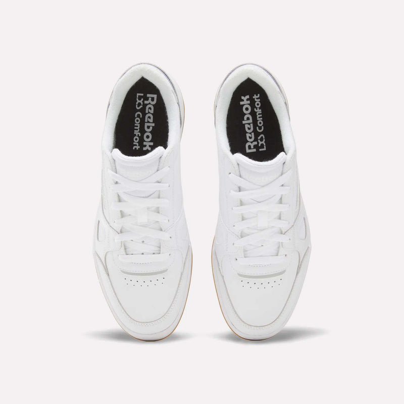 Top view of the men’s Reebok Court LXS Shoes in white, crafted from full grain leather with white laces and perforated toe detailing, displayed side by side on a light background—an ideal option for men’s court footwear.