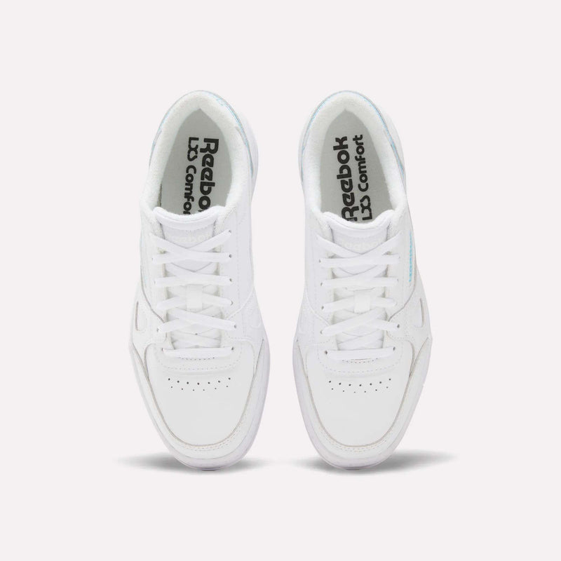 A pair of white Reebok Women’s Court LXS Shoes viewed from above, featuring white laces, perforated toe boxes, and Reebok LD Comfort printed on the insoles. Crafted from premium full grain leather, these women’s court shoes blend timeless style with lasting comfort.