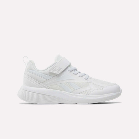 The Reebok Rush Runner 6.0 Elastic Lace Top Strap Running Shoes for little kids feature a white design with mesh and synthetic overlays, a hook-and-loop strap, low profile, and textured sole—shown side view on white. Ideal kids' running shoes.