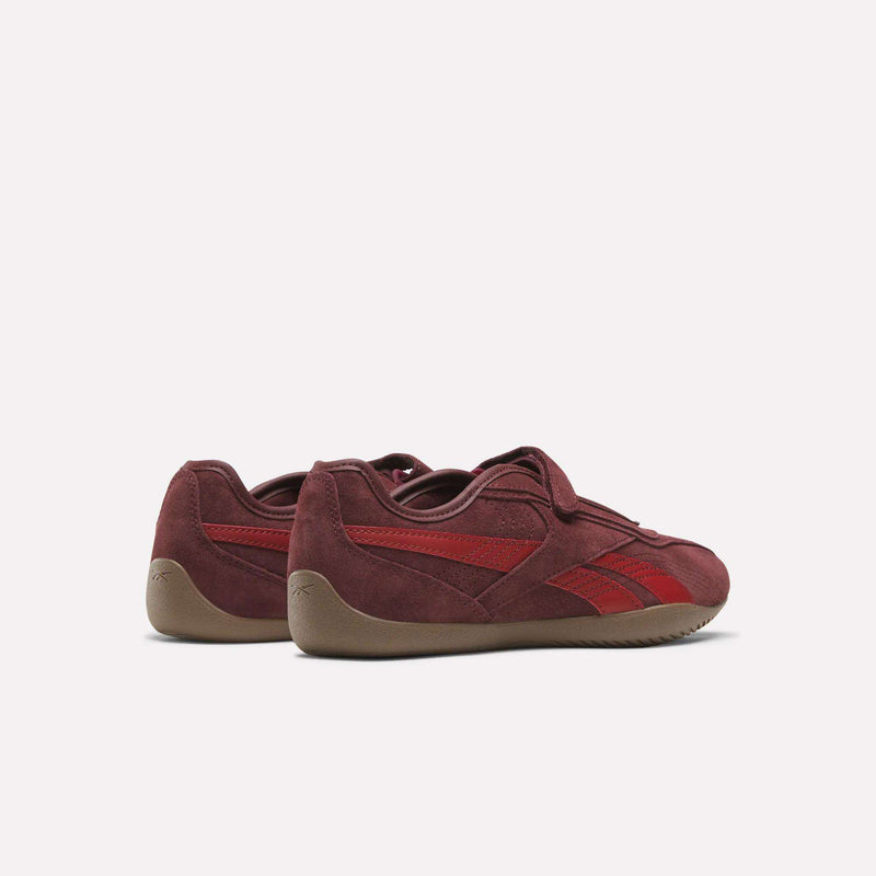A pair of maroon Women’s Ultra Lo Mary Jane Shoes by Reebok, featuring gum soles, displayed from the back and side angles on a light background.