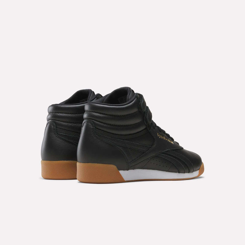Women’s Freestyle Hi Shoes in black with white midsoles and gum rubber outsoles.