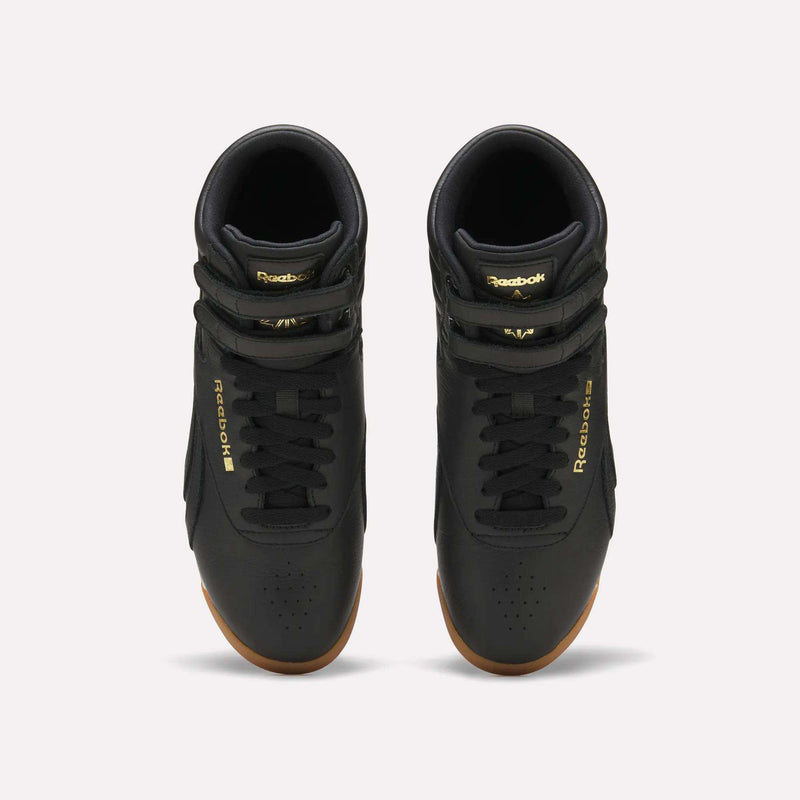 Top-down view of black Reebok Women’s Freestyle Hi Shoes with two ankle straps and gum-colored outsoles.