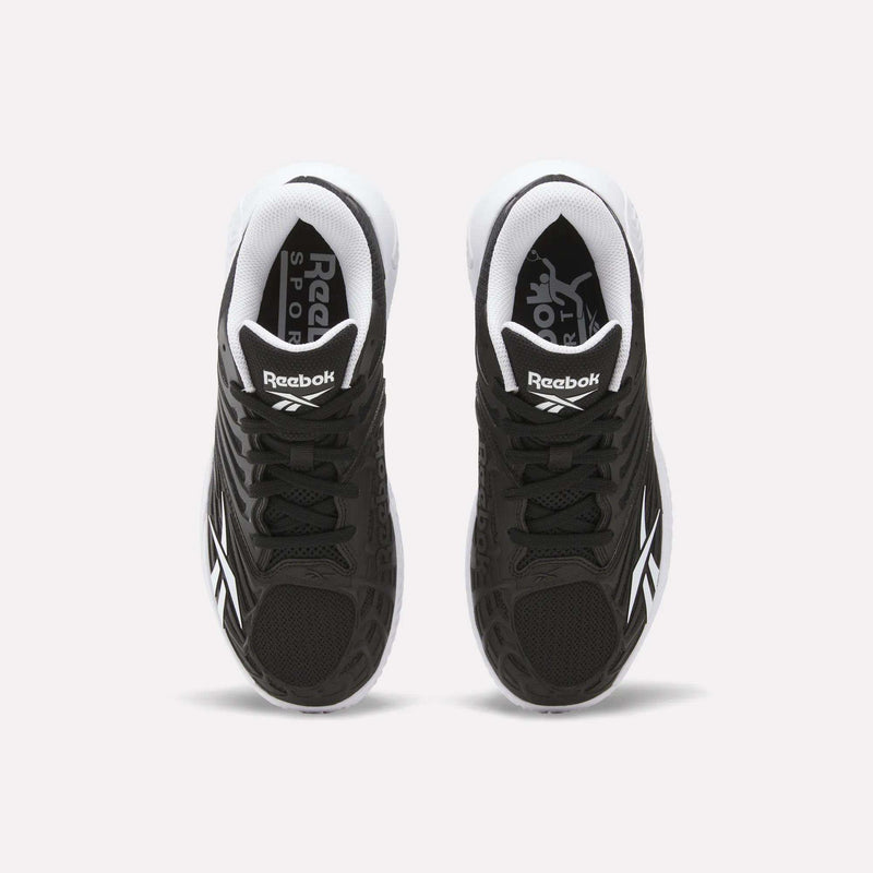 A pair of Reebok Women's Phase Evo Tennis Shoes in black with white accents is shown from above on a light background, featuring the Reebok logo on the tongue and side.