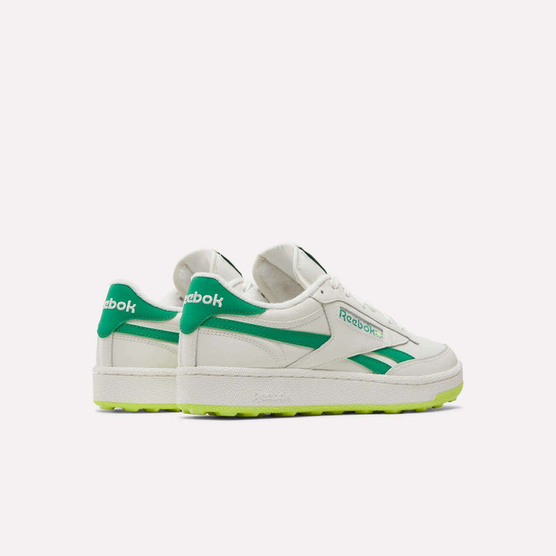 Reebok Men’s Club C Revenge Golf Shoes in off-white with green side stripes, green heel tabs, and bright lime-green spikeless outsoles.