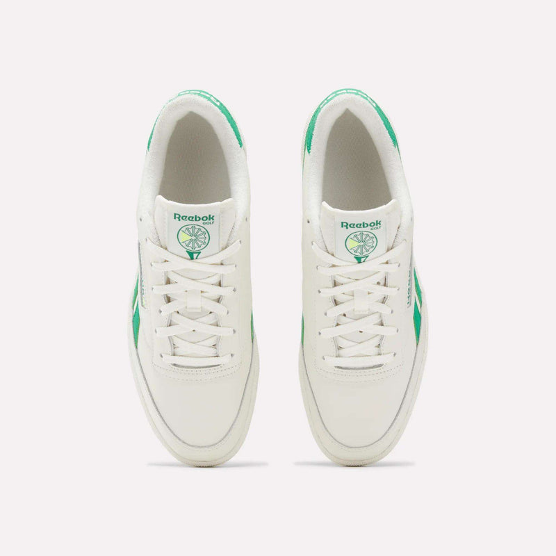 Top-down view of a pair of white Men’s Club C Revenge Golf shoes with green accents, Reebok branding on the tongues, and a spikeless outsole.