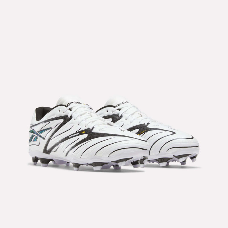 A pair of Reebok Sidewinder 26 League Firm Ground Cleats in white with black and teal accents, designed with firm ground studs for enhanced traction and ball control, displayed on a plain light background.