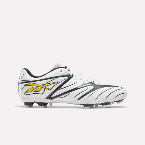 White Reebok Sidewinder 26 League Firm Ground Cleats featuring black accents and a yellow logo on the side for improved ball control.