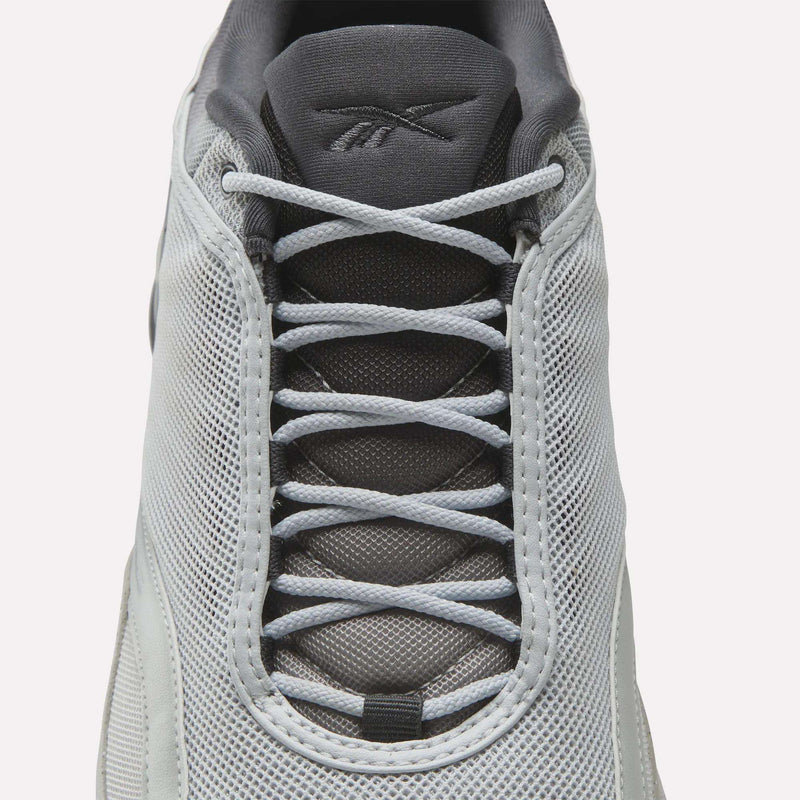 Top view of a white Reebok Mita Sneakers x DMX Series 3000 shoe with light gray laces, mesh upper, and dark gray tongue with the Reebok logo—features DMX moving air technology for enhanced comfort.