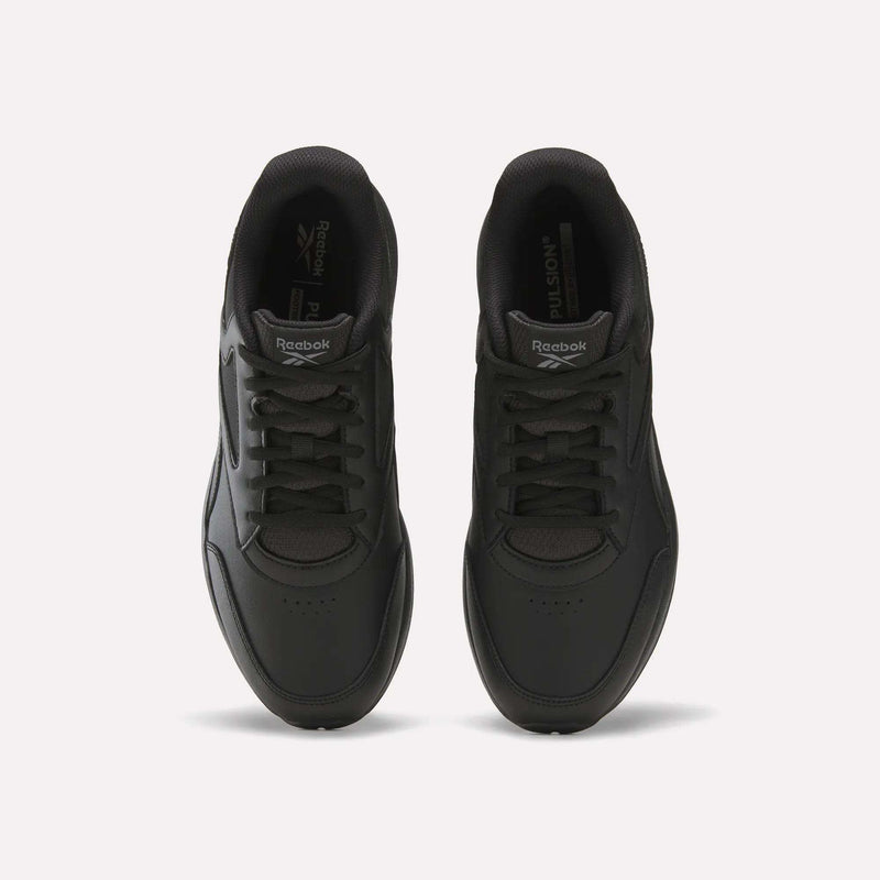 Top view of a pair of Reebok Men's Walk Ultra 7 DMX Max Shoes in black with matching black laces, displayed side by side on a white background. Equipped with DMX cushioning, these shoes offer enhanced comfort and stylish support for everyday walking.