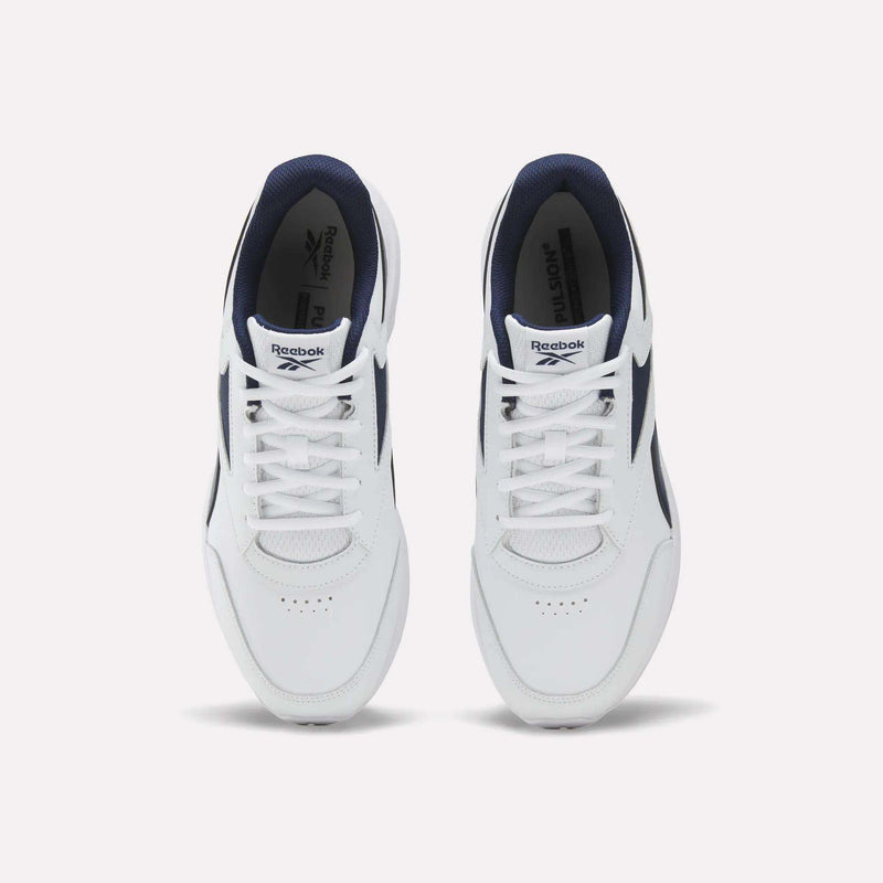 A top-down view of the Men's Walk Ultra 7 DMX Max Shoes by Reebok, featuring a white design with navy blue accents and DMX cushioning, displays the tops and laces of both shoes against a plain white background.