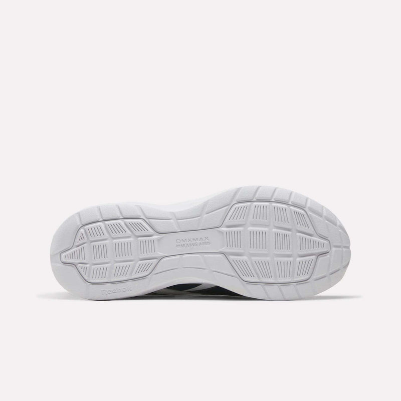The image displays the white, textured rubber outsole of the Reebok Men's Walk Ultra 7 DMX Max Shoes - Wide 4E, showcasing DMX cushioning, as seen from the bottom against a plain light background.