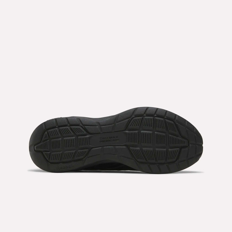 Black sneaker outsole viewed from the bottom, revealing a textured tread pattern with grooves and geometric shapes for traction—ideal for those seeking features similar to the Reebok Men's Walk Ultra 7 DMX Max Shoes - Wide 4E. The text DAY MAX and COLE HAAN are visible in the center.