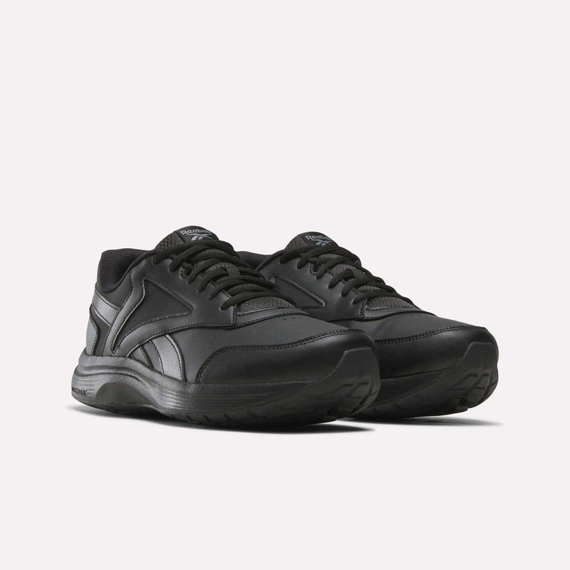 A pair of Reebok Men's Walk Ultra 7 DMX Max Shoes - Wide 4E in black, showcasing lace-up fronts, padded collars, and textured rubber soles with DMX cushioning for superior comfort, displayed against a white background.