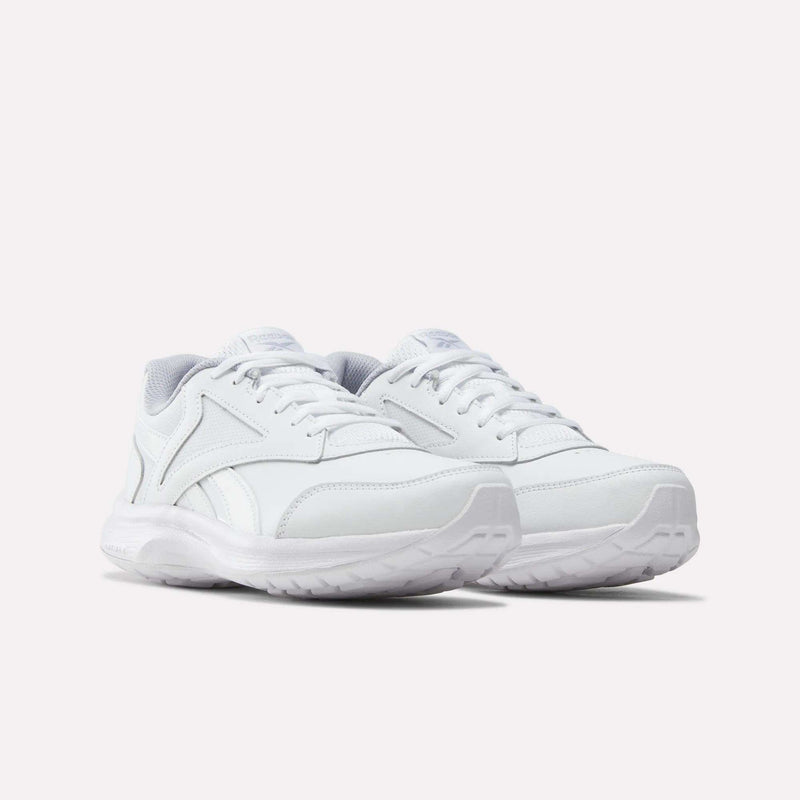 A pair of Women’s Walk Ultra 7 DMX Max Shoes by Reebok, white athletic sneakers with laces and a minimal design featuring textured soles, are placed side by side on a plain white background—these shoes are designed to deliver all-day comfort and effortless style.