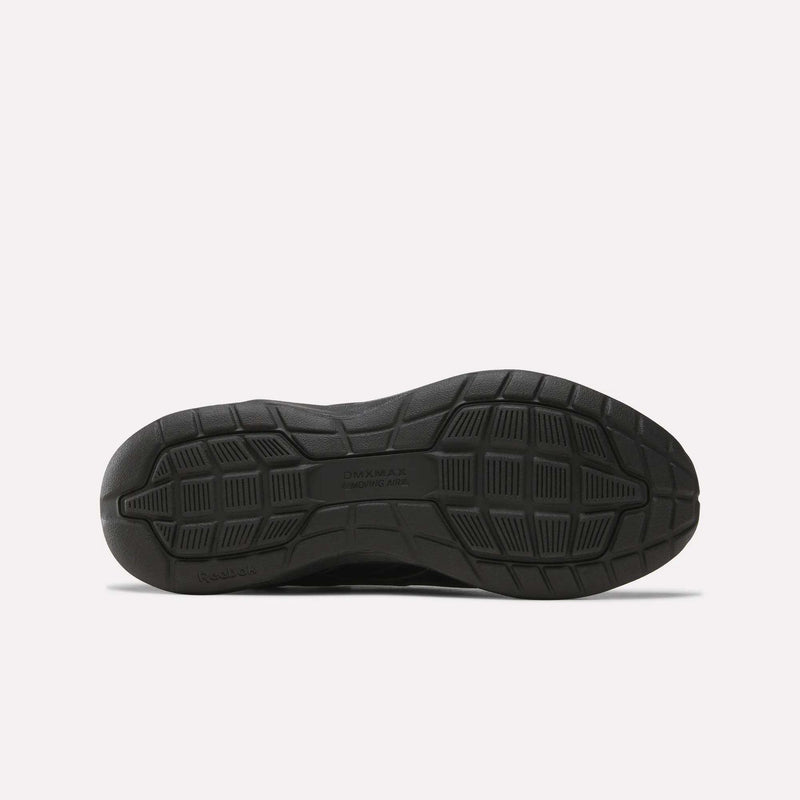 Close-up view of the sole of a Women’s Walk Ultra 7 DMX Max Shoe by Reebok, showcasing textured rubber with geometric tread patterns engineered for grip and support—expertly crafted for all-day comfort and perfect as Reebok walking shoes for women.