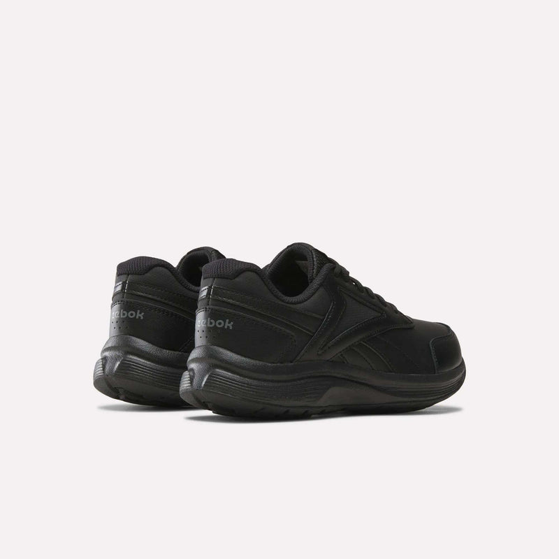 A pair of Reebok Women’s Walk Ultra 7 DMX Max Shoes in black, shown from the side and back on a plain white background—these wide-fit walking sneakers are designed for all-day comfort, making them an ideal choice for women seeking supportive Reebok walking shoes.