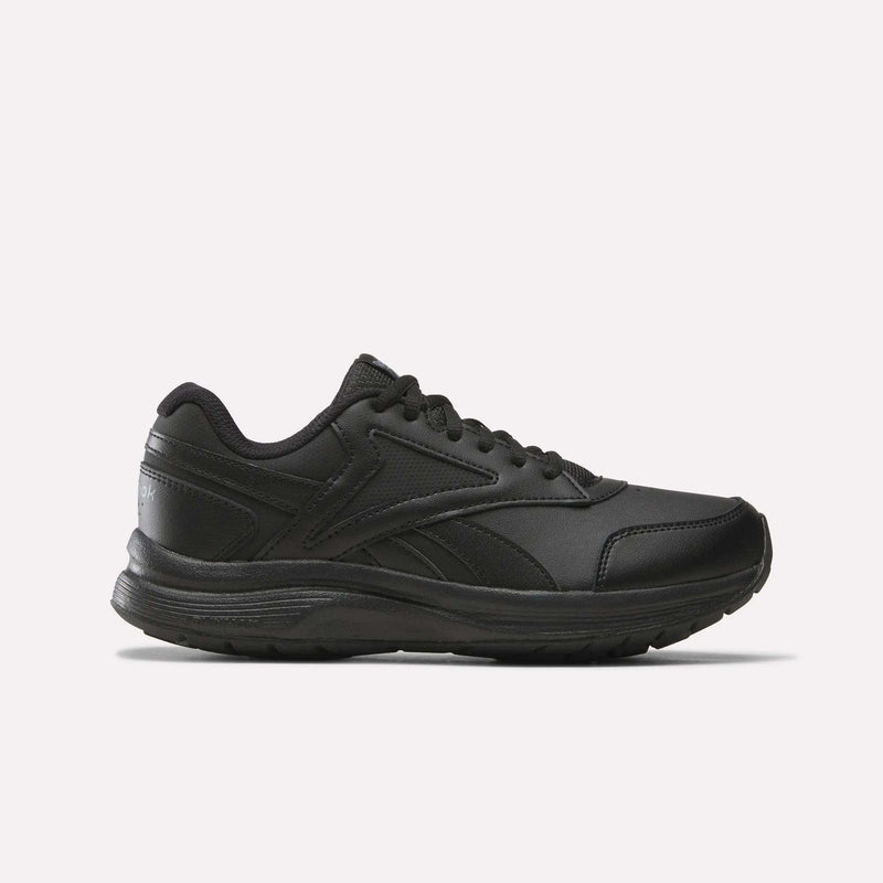 A black, low-profile athletic sneaker featuring a textured sole and black laces—pictured in side view against a plain white background—blends the sleek style of Reebok’s Women’s Walk Ultra 7 DMX Max Shoes (Wide D) in Black/Cold Grey 5/Collegiate Royal with an emphasis on all-day comfort.