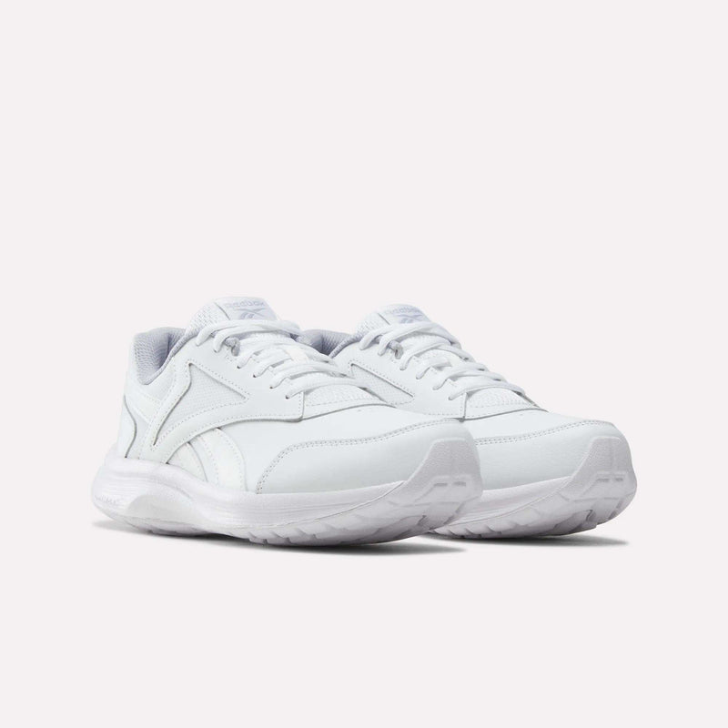 A pair of Women’s Walk Ultra 7 DMX Max Shoes - Wide D by Reebok, in white with laces and designed for all-day comfort, is shown on a plain white background and angled slightly to the right.