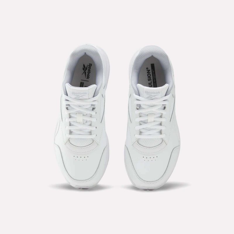 A pair of Women’s Walk Ultra 7 DMX Max Shoes - Wide D by Reebok in white, viewed from above with visible laces and the Reebok logo on the insoles against a plain white background. Engineered for all-day comfort, these sneakers are ideal for everyday wear.