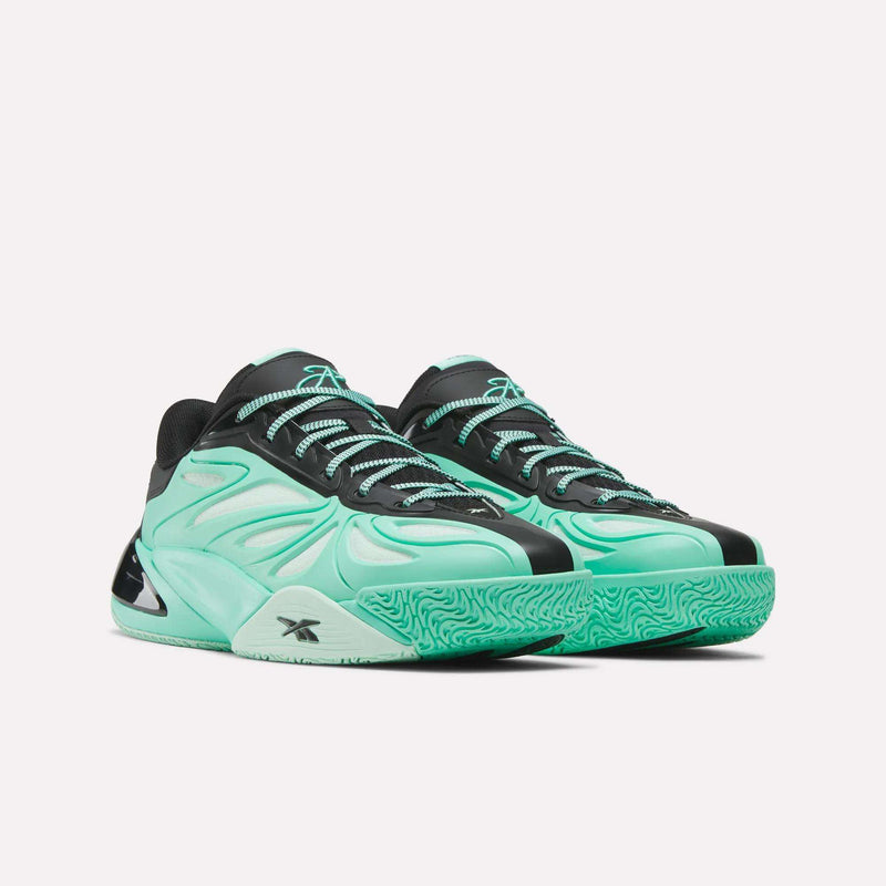Introducing the Angel Reese 1 Basketball Shoes by Reebok—a pair of mint green and black athletic sneakers designed for the court with a sculpted silhouette, textured soles, and black laces. Engineered with the Reebok Energy Return System for enhanced comfort and responsiveness, these performance basketball shoes are finished with the iconic Reebok logo on both the side and tongue.
