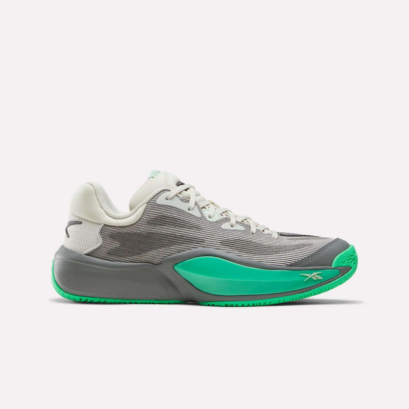 A pair of Reebok Engine A 26 Basketball Shoes in Grey 4/New Grey 1/Optical Emerald, featuring a gray athletic design with white laces, green (Optical Emerald) accents on the sole and side, and an engineered mesh upper, displayed on a white background.