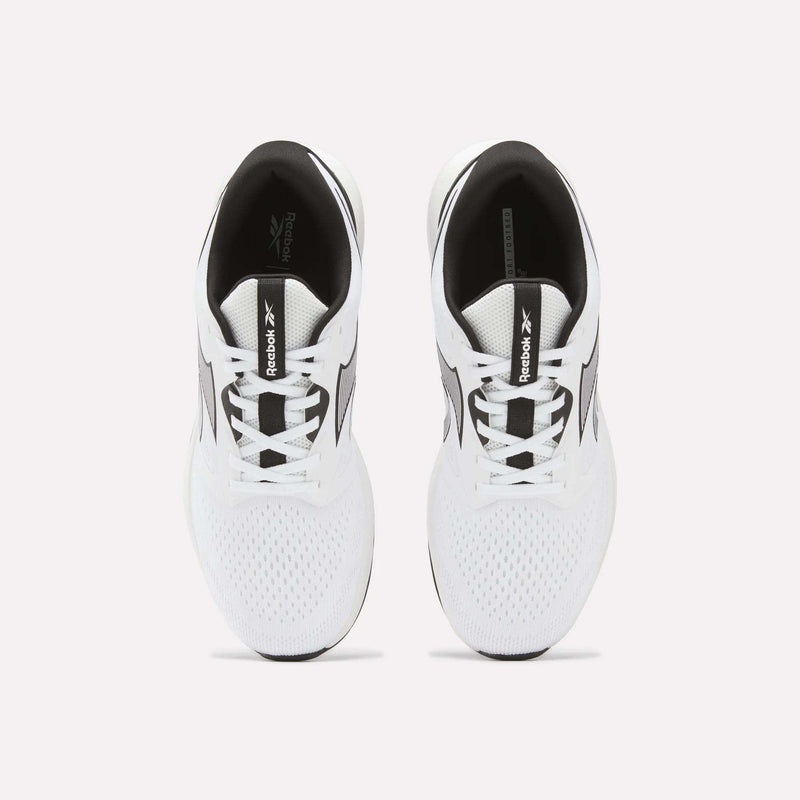 Top view of a pair of Reebok Men's Nanoflex 2 Training Shoes in white with black accents on a plain light background. These shoes feature breathable mesh uppers and visible Reebok branding on the tongues and sides.