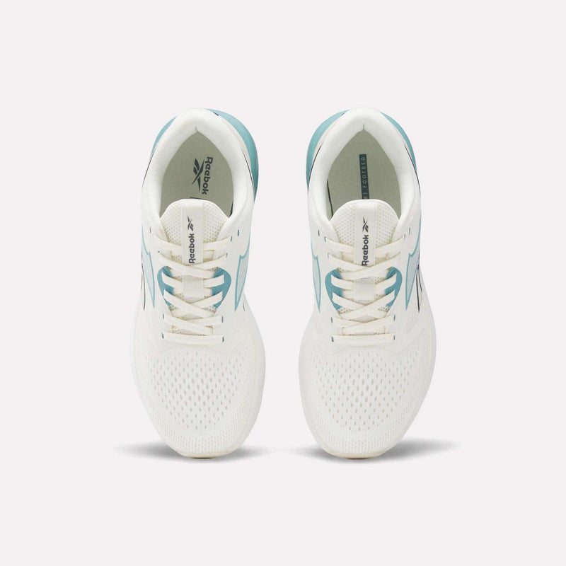 A pair of Reebok Women's Nanoflex 2.0 Training Shoes in white with teal accents, shown from above. These versatile workout shoes feature lace-up fronts and display the Reebok logo on the tongues and insoles.