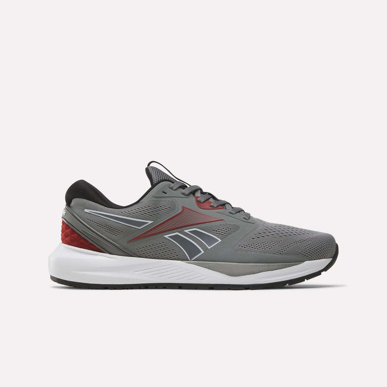 A side-profile view of the Reebok Men's Nanoflex 2 Training Shoes in Grey 4, Black, and Heritage Red, featuring black laces, red accents, a white sole, and breathable mesh construction for optimal comfort—displayed against a plain light background.