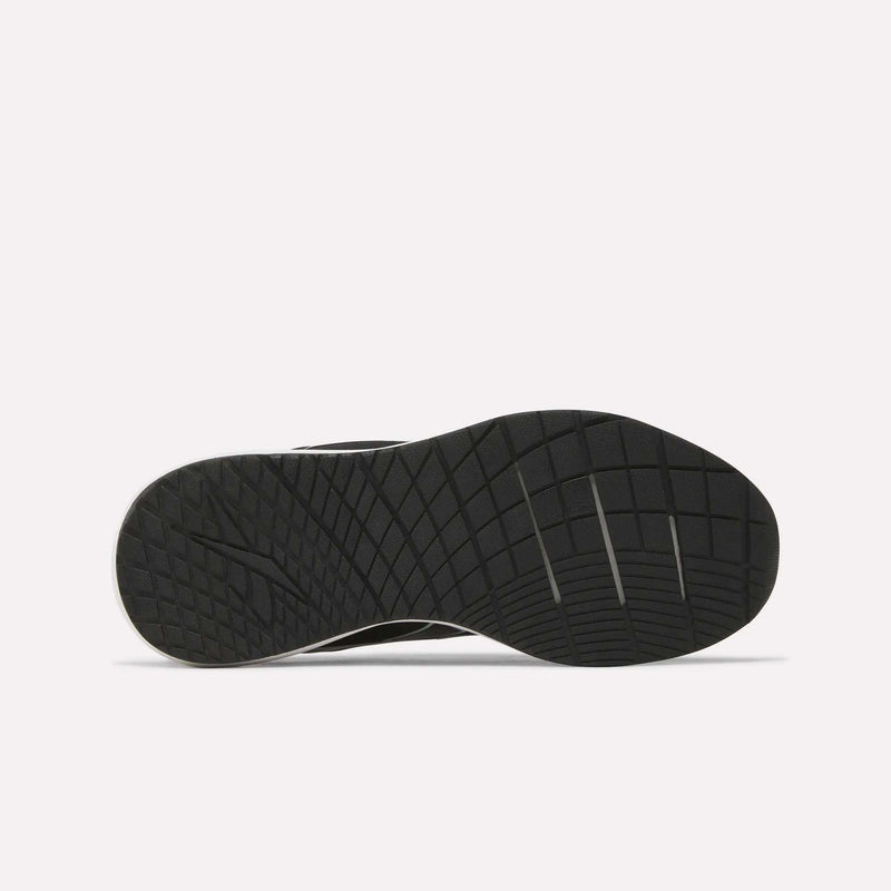 The image displays the black rubber outsole of the Reebok Women’s NFX Trainer 2 Training Shoes, featuring a grid and line tread pattern designed for traction, set against a plain white background.