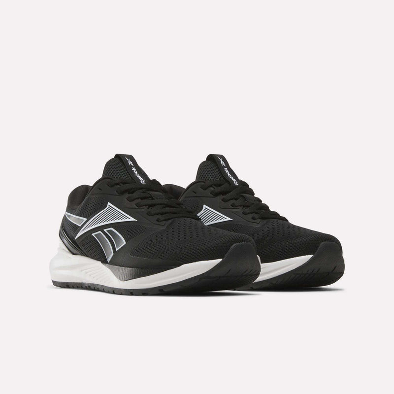 A pair of Reebok Women’s NFX Trainer 2 Training Shoes in black with white soles and silver accents, displayed on a plain white background.