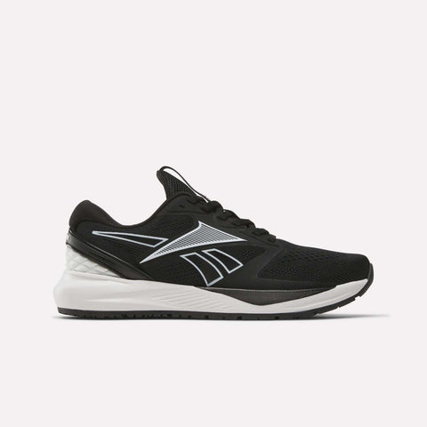 The Women’s NFX Trainer 2 Training Shoes by Reebok feature a black athletic design with white accents, a breathable mesh upper, and a white sole. The signature Reebok logo is displayed on the side, emphasizing its versatility as a gym shoe. The shoe is presented in a side view against a plain white background.