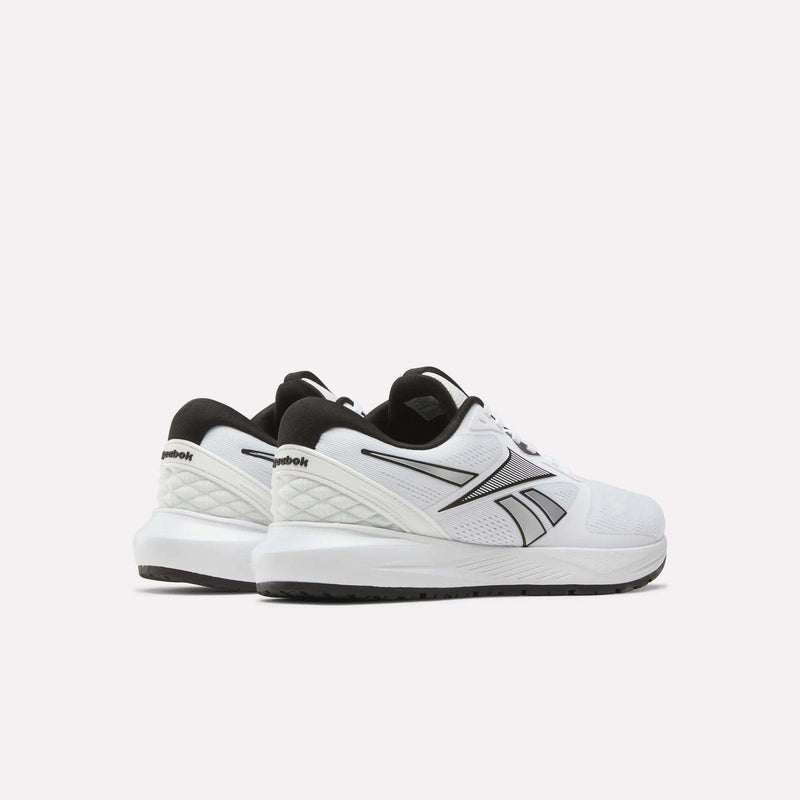 A pair of white Women's Nanoflex 2.0 Training Shoes by Reebok with black accents and a black sole, shown against a light background at an angle highlighting the side and back views.