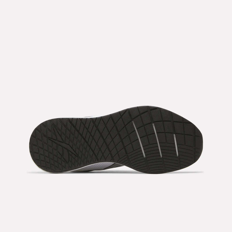 The image displays the black rubber outsole of the Reebok Women's Nanoflex 2.0 Training Shoes, featuring a geometric tread pattern, as seen from the bottom against a plain white background.