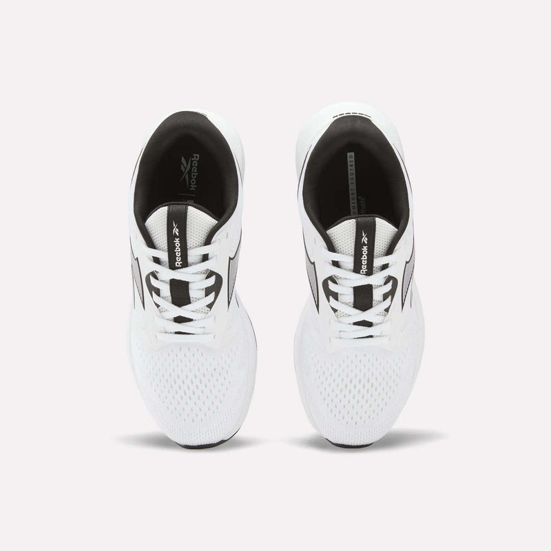 A pair of Reebok Women's Nanoflex 2.0 Training Shoes in white with black accents is shown from above, displaying the laces and mesh toe area. The shoes are placed side by side on a plain light background.