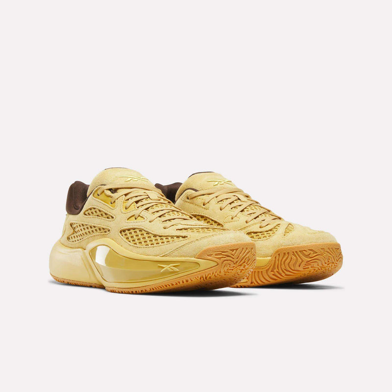 A pair of Reebok Engine A 26 Basketball Shoes in yellow with brown accents, featuring mesh panels and textured rubber soles for enhanced stability, displayed on a white background.