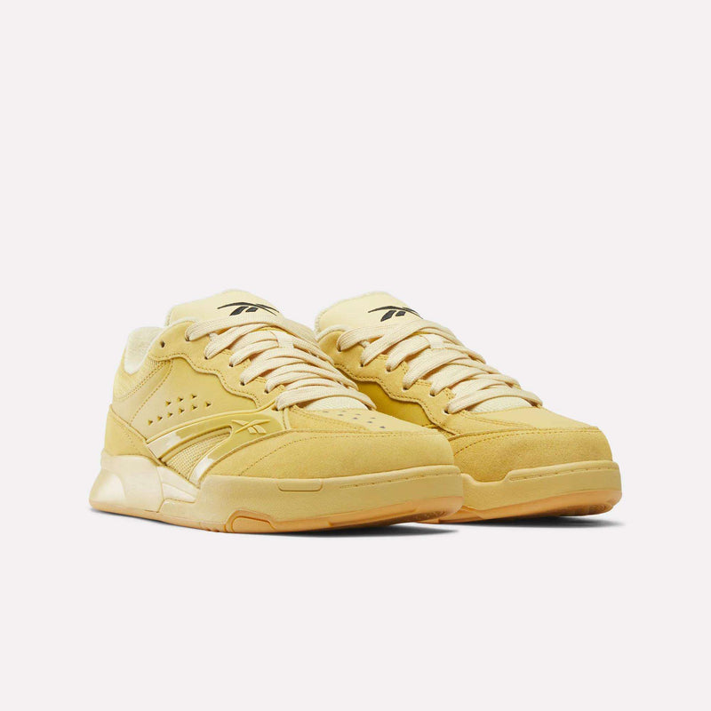 Omni Edge Shoes in yellow, featuring a low-top, hoops-inspired design with tonal laces and textured side panels accented by leather and suede overlays.
