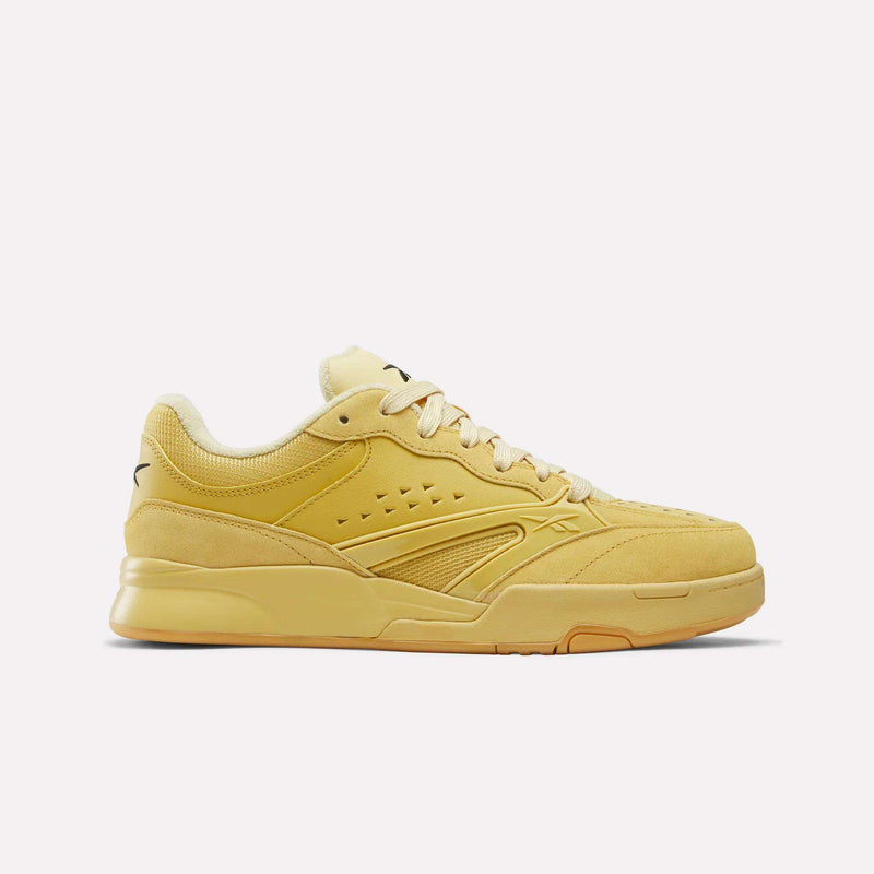 Wheat-colored, hoops-inspired Reebok Omni Edge low-top sneakers featuring leather and suede overlays, tonal laces, and a rubber sole.