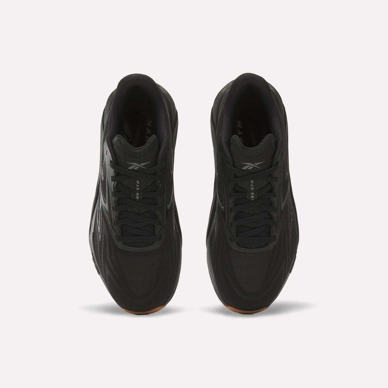 Top view of Reebok Nano Gym 2.0 Training Shoes in black with black laces, subtle logo on the tongue, and high-rebound foam cushioning, displayed on a plain white background.
