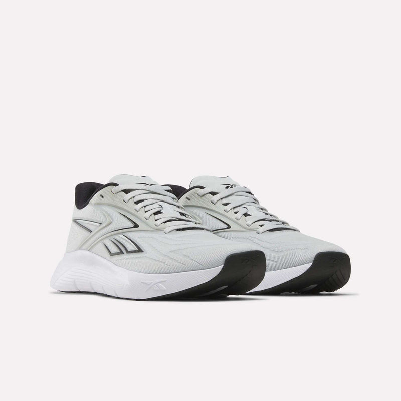 The Reebok Nano Gym 2.0 Training Shoes feature a light gray design with white soles, black accents, and side logos. Shown on a plain white background, they’re perfect for gym workouts or everyday use.