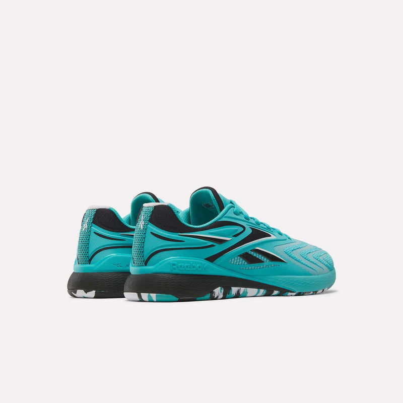 A pair of Women’s Nano X5 Edge Training Shoes by Reebok in teal, featuring black detailing and patterned black-and-white soles, showcased on a plain white background—crafted for women seeking both stylish design and high-performance workout footwear.