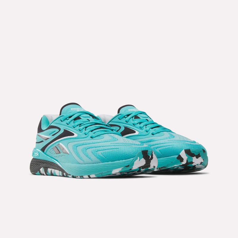 Step up your HIIT class in Women's Nano X5 Edge Training Shoes by Reebok—turquoise trainers with bold black and white accents, a patterned sole, and signature Reebok branding for standout style and performance.