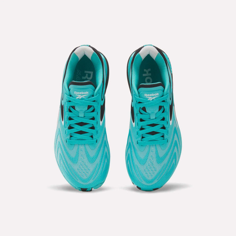 A pair of Reebok Women’s Nano X5 Edge Training Shoes in vibrant turquoise, seen from above with striking black accents, white soles, and patterned mesh uppers—an ideal choice for women seeking both high-performance workout footwear and standout style.