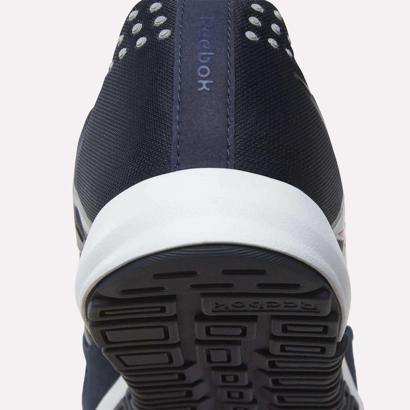 Close-up of the heel and sole of the Men’s Nano 2.0 Training Shoes by Reebok in navy blue, featuring a textured black outsole, white midsole, and visible Reebok branding on the heel—ideal for functional fitness enthusiasts.