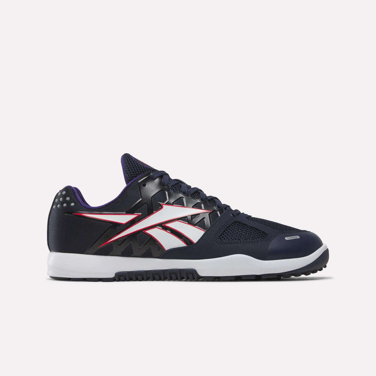 A Vector Navy/White athletic sneaker featuring black, white, and red accents with a distinctive white and red side logo, black laces, white midsole, and black outsole set against a plain light background—these are the Men’s Nano 2.0 Training Shoes by Reebok. Inspired by the iconic Nano 2.0 silhouette, this ultimate training shoe is engineered for functional fitness enthusiasts, offering both standout style and peak performance wherever your workout takes you.