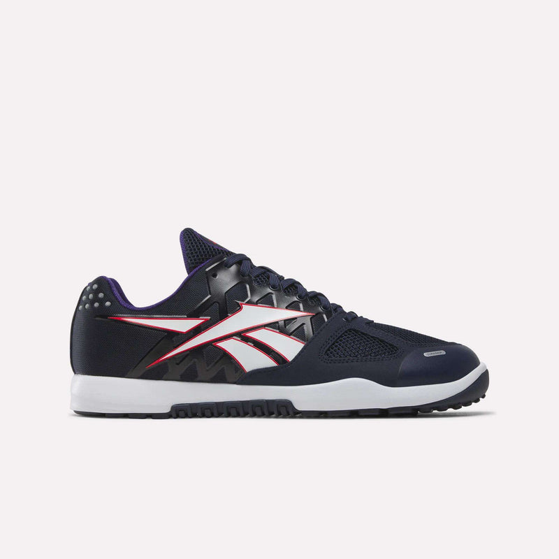 A Vector Navy/White athletic sneaker featuring black, white, and red accents with a distinctive white and red side logo, black laces, white midsole, and black outsole set against a plain light background—these are the Men’s Nano 2.0 Training Shoes by Reebok. Inspired by the iconic Nano 2.0 silhouette, this ultimate training shoe is engineered for functional fitness enthusiasts, offering both standout style and peak performance wherever your workout takes you.